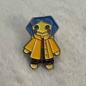 Coraline lapel pin